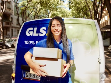 Employee delivering parcels with van in the back
