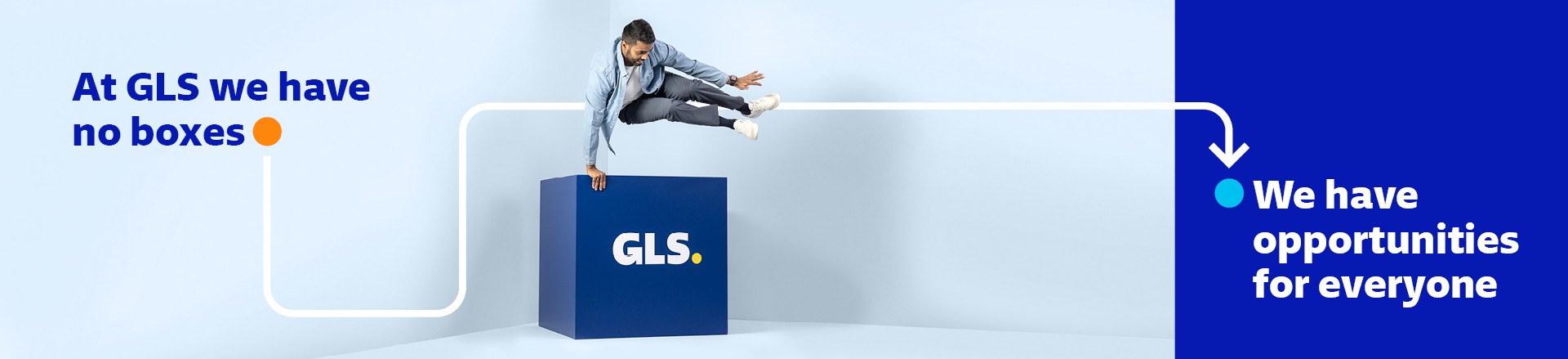 Man jumping over a GLS cube